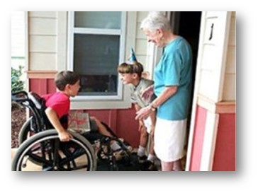 A boy in a wheelchair can enter a home through the front doorway