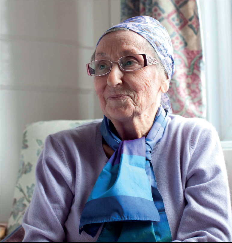 An elderly lady in her chair at home
